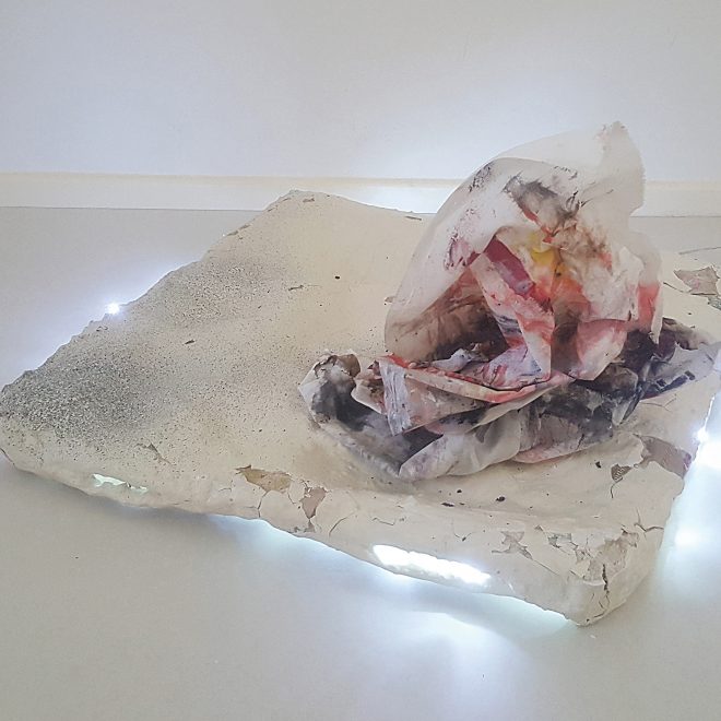 Left Overs no more ii_Rajaa Paixao_burnt watercolour on fabric, pebble stones, chicken wire, paper mache, hooks, resin plaster, spray paint, light string_36 x 58 x 58 cm (angle 2)